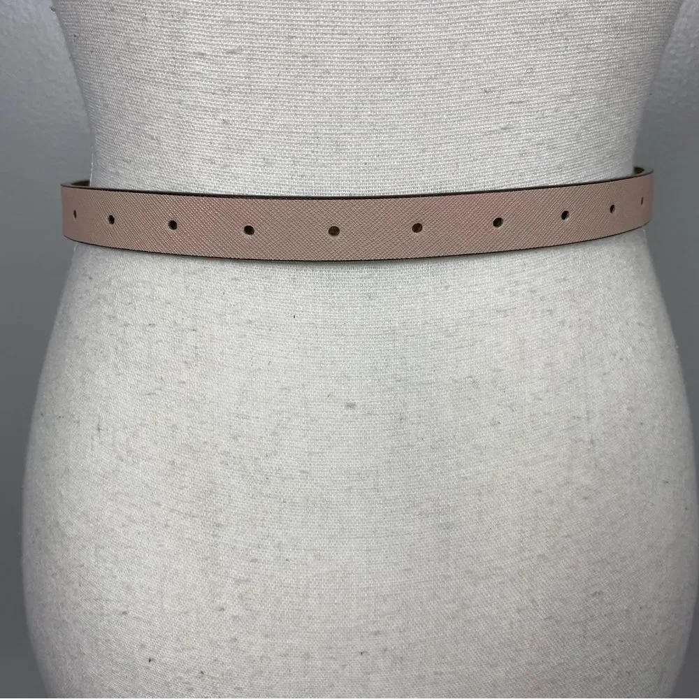 Michael Kors slim pink leather belt with a gold-tone pin buckle.